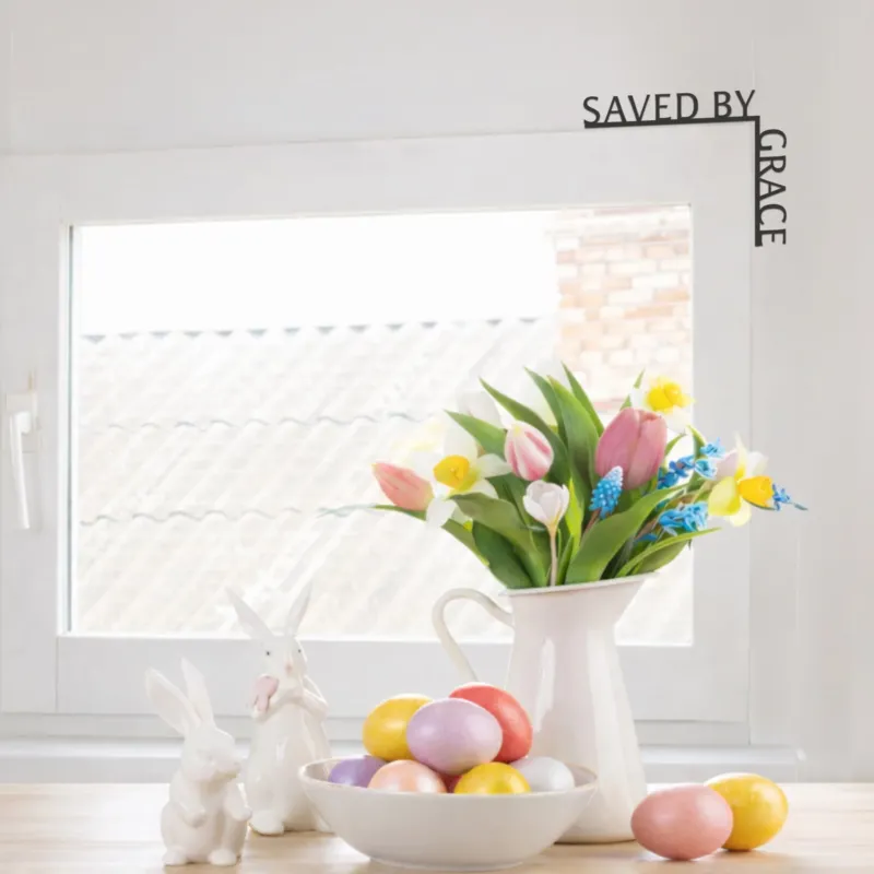 Decorative setup with Easter eggs, flowers, and bunnies on a white surface.