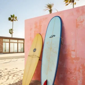 Surfboards Resting Against a Pink Wall